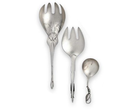 comprising: an ornamental pattern serving-fork, chased with foliage and with a spiral shell finial, 1915-1932, model number 5