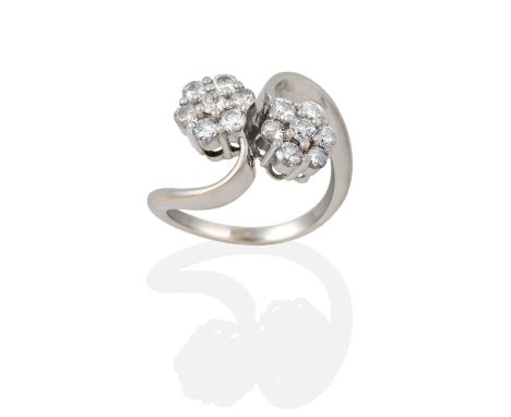 the clusters formed of round brilliant cut diamonds, in claw settings, to a twist shoulder plain polished shank, total estima