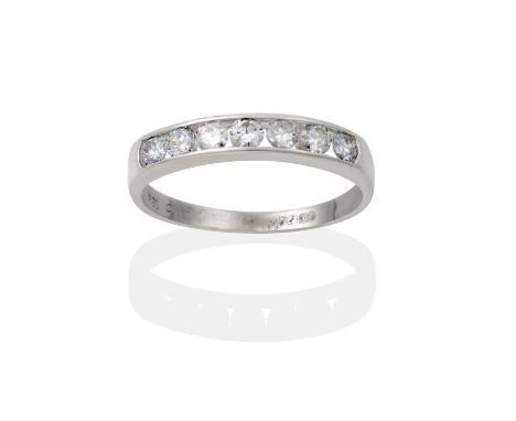 the seven round brilliant cut diamonds in a channel setting, to a plain polished shank, total estimated diamond weight 0.40 c