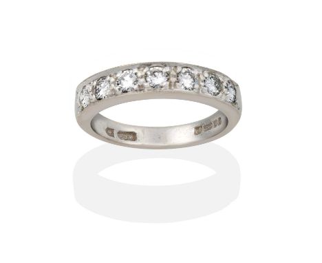the seven round brilliant cut diamonds in claw and millegrain settings, to a plain polished shank, total estimated diamond we