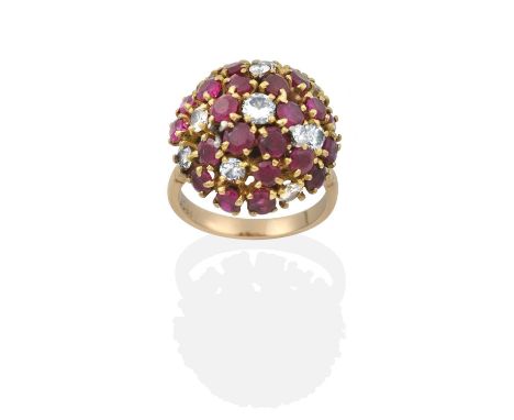 the domed cluster set throughout with round cut rubies and round brilliant cut diamonds, in white and yellow claw settings, t