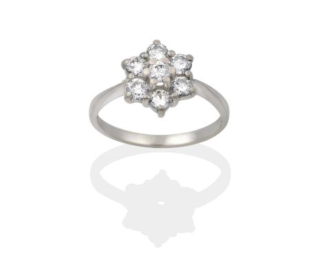 the cluster formed of round brilliant cut diamonds in claw settings, to a tapered shoulder plain polished shank, total estima