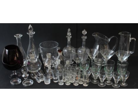 A selection of glassware to include to include drinking glasses, three large cocktail glasses, a set of four light-green glas