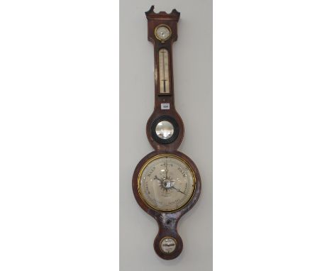 An early 19th century mahogany-cased wheel barometer; the broken swan-neck pediment above a dry/damp dial and thermometer wit