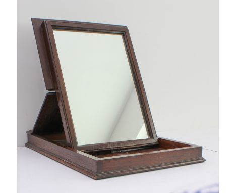 A 19th century oak and mahogany folding campaign-style mirror: the rectangular case with a double hinged lid, opening to reve