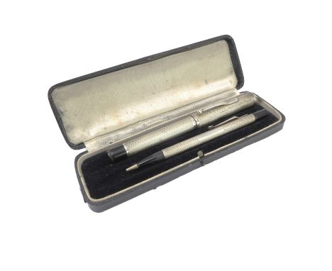 A George VI silver cased leverless fountain pen and propelling pencil set: William Manton, Birmingham 1937, with engine turne