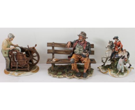 Three Capodimonte porcelain figures:  1. Tramp on bench (25.5 cm wide). 2. 'The Knife Blade Sharpener' (20.5 cm high). 3. Mou