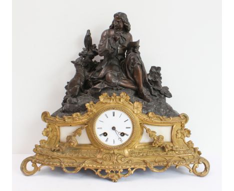 A 19th century French spelter and gilt-metal-mounted eight-day figural mantle clock: white enamel dial with Roman numerals an