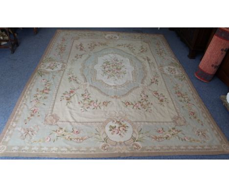 A French&nbsp;Aubusson tapestry: predominately beige ground and with a very light turquoise blue border, profusely decorated 
