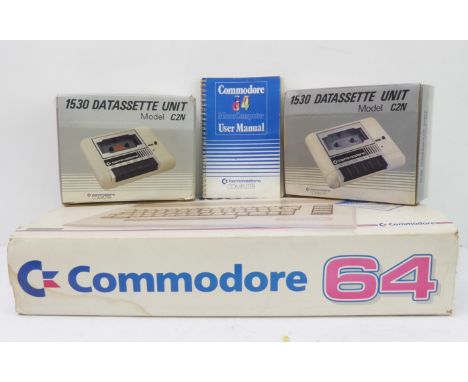 A boxed Commodore 64 home micro computer, serial no. 241370, complete with power supply and leads (untested0. Together with t