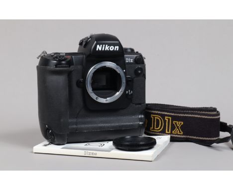 A Nikon D1x DSLR Camera Body, serial no 5001693, body G, some wear to edges, scratches to base, with body cap, strap, manual,