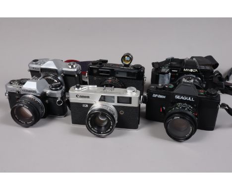 A Group of 35mm Cameras, an Olympus OM-10, with F Zuiko 50mm f/1.8 lens, a Yashica Electro 35 GTN,  a Minolta 7000AF, a Seagu