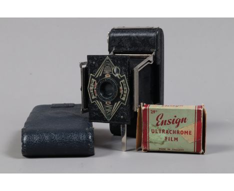 An Ensign Midget Folding Strut Camera, shutter working, body G, elements G, with leather case, with two rolls of Ultrachrome 