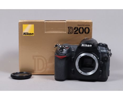 A Nikon D200 DSLR Camera Body, powers up, shutter working, body G, with charger, battery, strap, manual, in maker's box