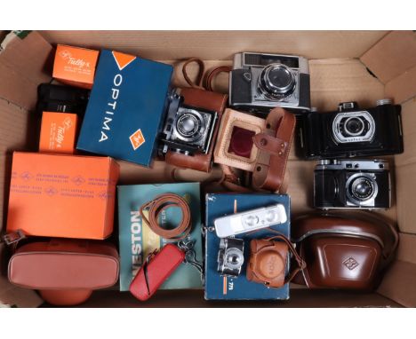 A Camera Collection, comprising two Kodak Retina II Type 142 rangefinder cameras, a Minox A subminiature camera in a red ERC,