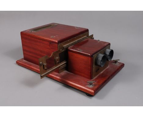 An unususal mahogany stereoscopic projector for pairs of 4.5cm x 4.5cm medium format transparencies,  with electric illuminan