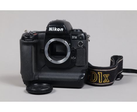 A Nikon D1x DSLR Camera Body, serial no 5126555, body G, some scratches to base, with body cap, strap, manual, battery and ch