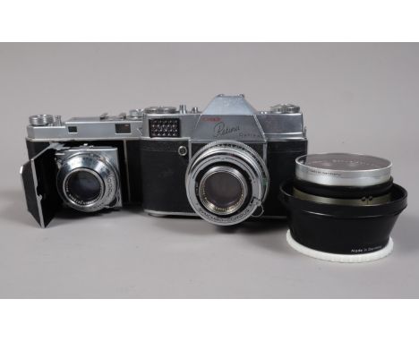 Two Kodak Retina Cameras and an Accessory Lens, comprising a Kodak Retina Reflex Type 025 SLR camera, serial no 56513, shutte