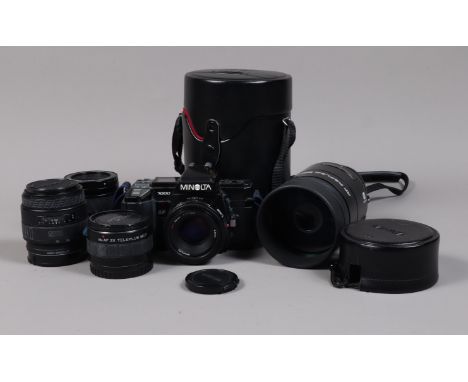 A Minolta 7000 AF SLR Camera Outfit, comprising a Minolta 7000, serial no 14176329, body F, whitening to grip, LCD screen par