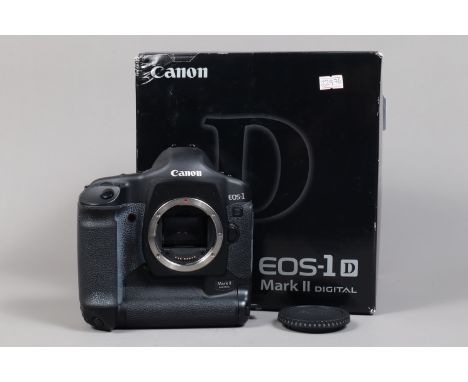 A Canon EOS-1D Mark II DSLR Camera Body,  serial no 252850, body G, light wear, with body cap, strap, AC adapter, DC coupler,