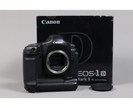 A Canon EOS-1D Mark II N DSLR Camera Body,   serial no 423206, body G, light wear, with body cap, AC adapter, DC coupler, bat