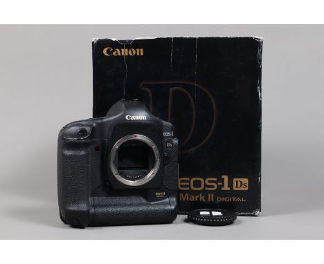 A Canon EOS-1 Ds Mark II DSLR Camera Body, serial no 334559, body G, some wear, with body cap, AC adapter, DC coupler, batter