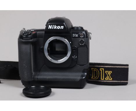 A Nikon D1x DSLR Camera Body, serial no 5139419, body G, light wear, with body cap, strap, manual, battery and charger