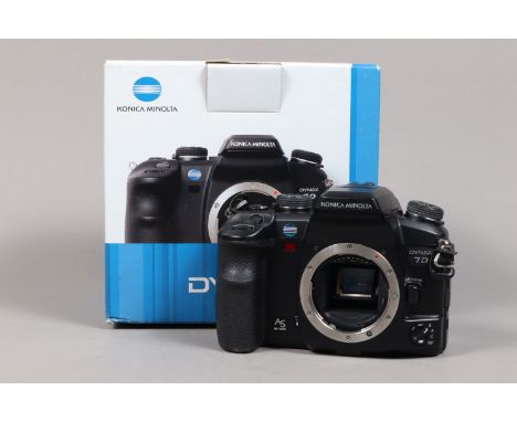 A Konica Minolta Dynax 7D DSLR Camera Bodys, powers up, shutter working. body G-VG, with battery &amp; charger, manual, in ma