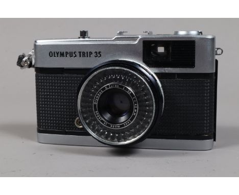 An Olympus Trip 35 Compact 35mm Camera, silver button version, serial no 2799053, body G, shutter working, meter reacts to li