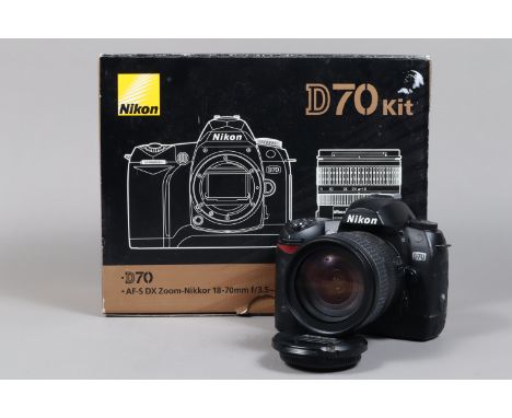 A Nikon D70 DSLR Camera Kit, powers up, shutter working, body G, slightly tacky grip, with AF Nikkor 18-70mm f/3.5-4.5G ED le