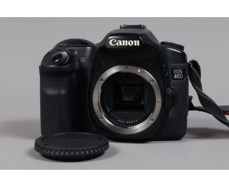 A Canon 40D DSLR Camera, powers up, shutter working, appears to function as should, body G, light wear, with battery, no char