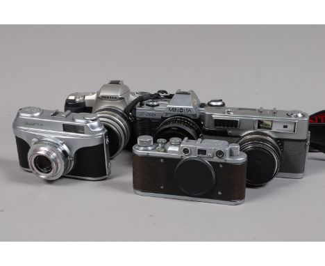 A Group of 35mm Cameras, including a Minolta X-300, shutter working, with Tamron 28mm f/2.5 lens, a Pentax MZ-7, with 35-80mm