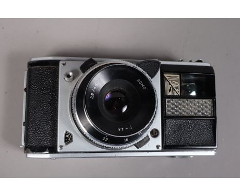 A Lomo Voskhod 35mm Camera, shutter working, light cell meter unresponsive, body G, some paint wear to edges, with 45mm f2.8 
