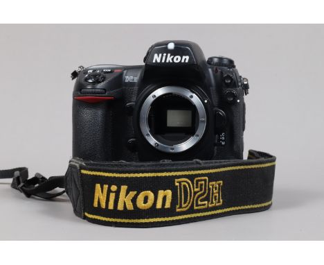 A Nikon D2H DSLR Camera body,  serial no 2036416, body Gsome wear, light scratches to base, with body cap, display screen cov