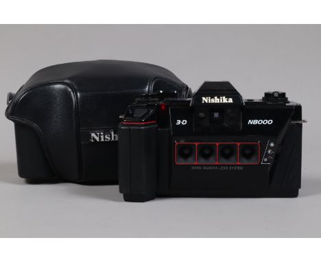 A Nishika 3D N8000 Stereo Camera, including Nishika camera, shutter working, a Nishika Twin Light 3010 electronic flashgun, m