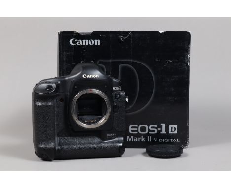 A Canon EOS-1D Mark II N DSLR Camera Body. serial no 422099, body G, light wear, with body cap, AC adapter, DC coupler, batte