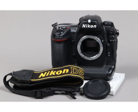 A Nikon D2Xs DSLR Camera Body, serial no 6003291, body G, some wear to edges, with body cap, display screen cover, strap, man