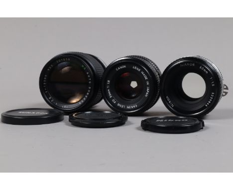 Three Prime Lenses, a Nikon  Nikkor 50mm f/1.8 Ai-S lens, barrel G, elements G and a Canon 50mm f/1.8 FD lens, barrel G and a