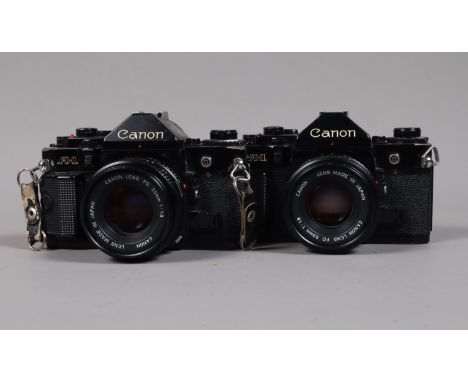 Canon A-1 SLR Cameras, comprising a Canon A-1, serial no 1824351, shutter working, meter reacts to light, a second A-1, seria