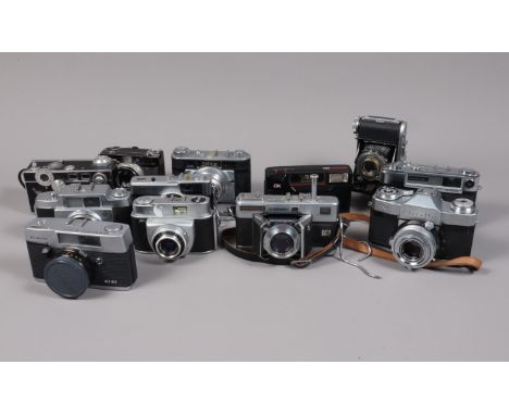 A Box of 35mm Film Cameras, comprising an Argus C2, a Zeiss Ikon Contaflex Rapid SLR, an Agfa Silette, a Balda Baldinette fol
