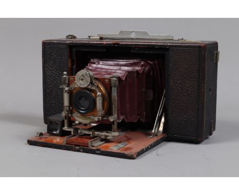 An Emil Wünsche Sirene Folding Camera, serial no 27716, circa 1903, for 9 x 12cm plates or 10 x 12.5cm roll film, body F, mar