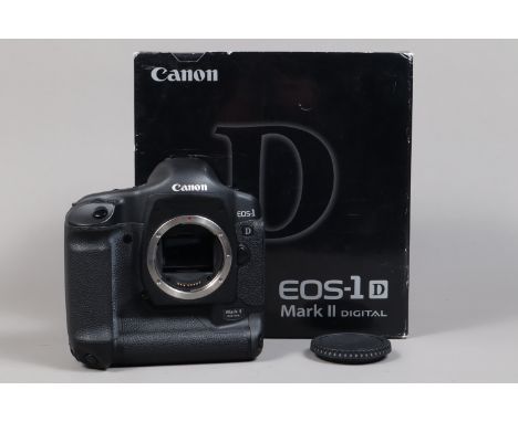 A Canon EOS-1D Mark II DSLR Camera Body, serial no 242591, body G, light wear, with body cap, AC adapter, DC coupler, battery