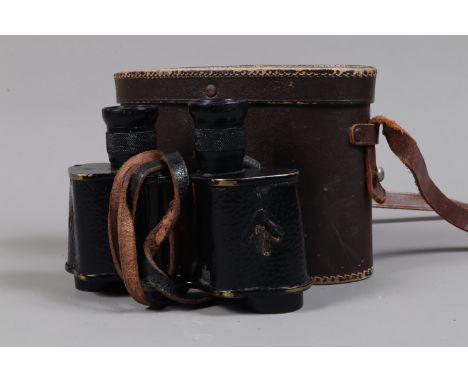 A Pair of W Watson &amp; Sons LTD Binoculars, X6, marked with military broad arrow, serial no 6101, some brassing to edges, e