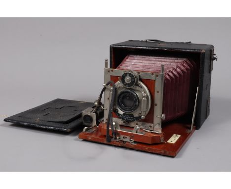 An Hugo Stöckig Union Folding Bed Camera, by Ernemann, 9 x 12 plate size, shutter sluggish, with Hugo Meyer 135mm f/7.2 Anast