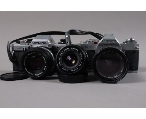 A Canon AV-1 and an Olympus OM10 SLR Cameras, AV-1 serial no 590059, an FD 35-70mm f/4 lens, OM10 serial no 1351210, fungus p