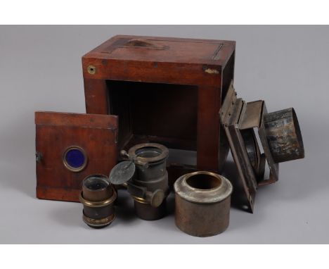 A Magic Lantern with Lenses, an incomplete wooden body magic lantern and two brass lenses with rack and pinion focusing in po