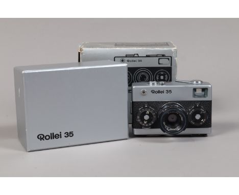 A Rollei 35 Compact 35mm Camera, made by Rollei Singapore, serial no 6026619, chrome body G, shutter sluggish at slow speeds,