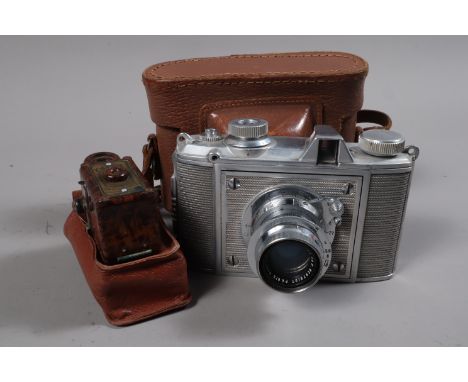 A Coronet Midget and a Pontiac Lynx II Cameras, a brown and black dappled Coronet Midget sub-miniature camera, body F-G, disc
