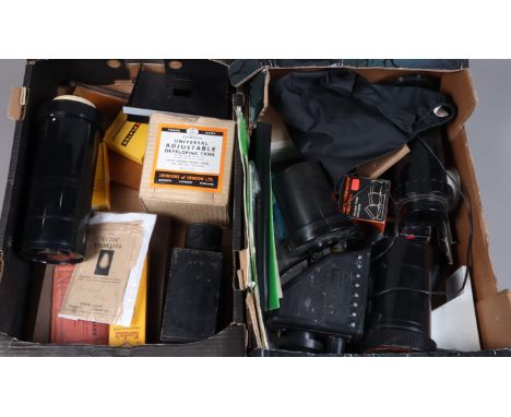 Two Trays of Darkroom Equipment, including Johnson Developing Tanks, tin plate safe light, enlarger parts and other items