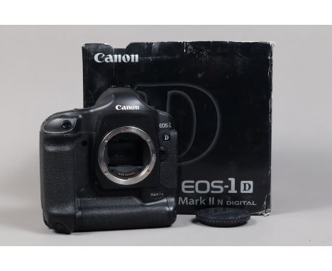 A Canon EOS-1D Mark II N DSLR Camera Body,   serial no 420350, body G, light wear, with body cap, hand strap, AC adapter, DC 
